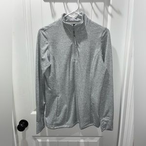 Quarter zip. Zipper works great. Thumb holes.